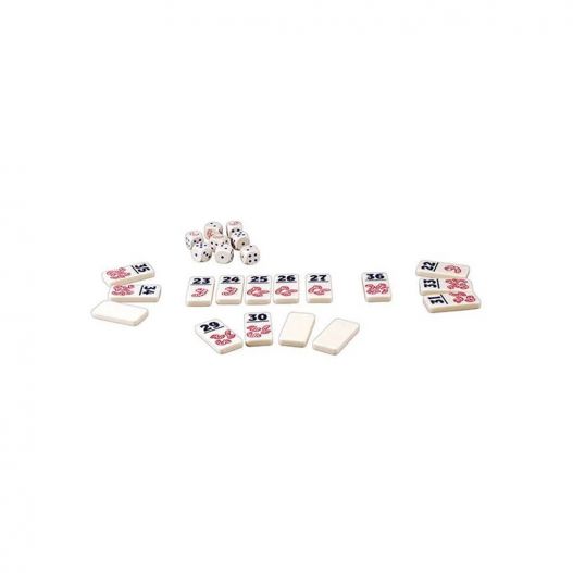 Vue d'ensemble de la mise en place du jeu Pickomino avec les dominos et les dés alignés sur une surface blanche.