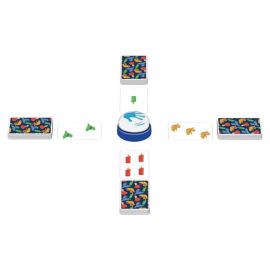 Matériel du jeu Halli Galli Magic Twist disposé en croix avec cartes colorées et sonnette au centre.