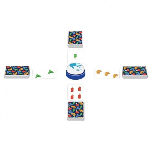 Matériel du jeu Halli Galli Magic Twist disposé en croix avec cartes colorées et sonnette au centre.
