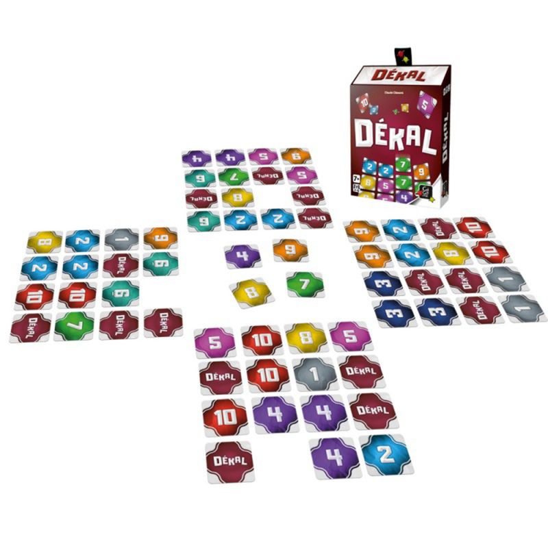 Vue complète du matériel du jeu DÉKAL avec la boîte et les cartes étalées en grille.